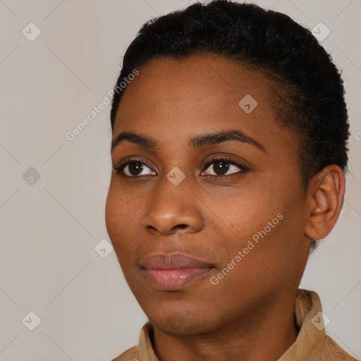 Joyful black young-adult female with short  brown hair and brown eyes