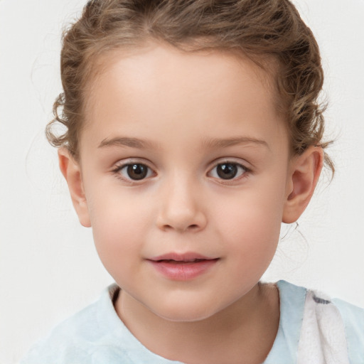 Joyful white child female with short  brown hair and brown eyes