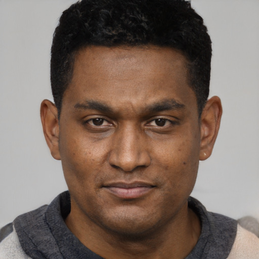 Neutral black young-adult male with short  black hair and brown eyes