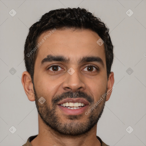 Joyful latino young-adult male with short  black hair and brown eyes