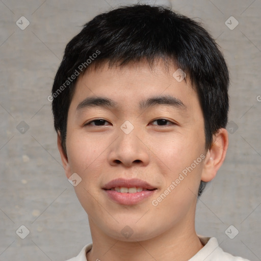 Joyful asian young-adult male with short  black hair and brown eyes