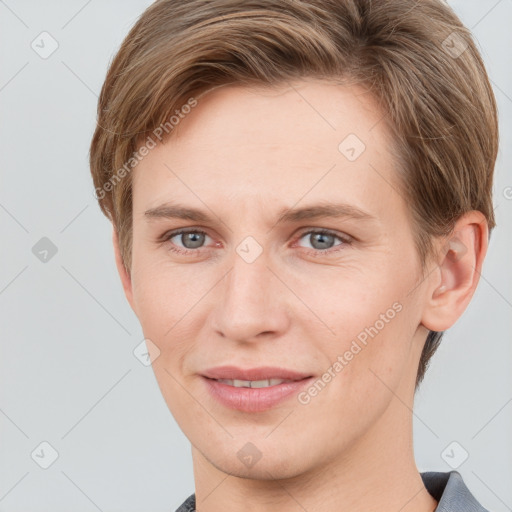 Joyful white young-adult female with short  brown hair and grey eyes