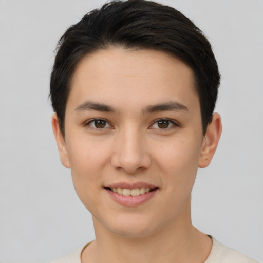 Joyful white young-adult female with short  brown hair and brown eyes