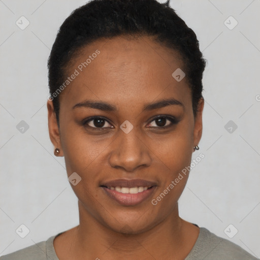 Joyful black young-adult female with short  black hair and brown eyes