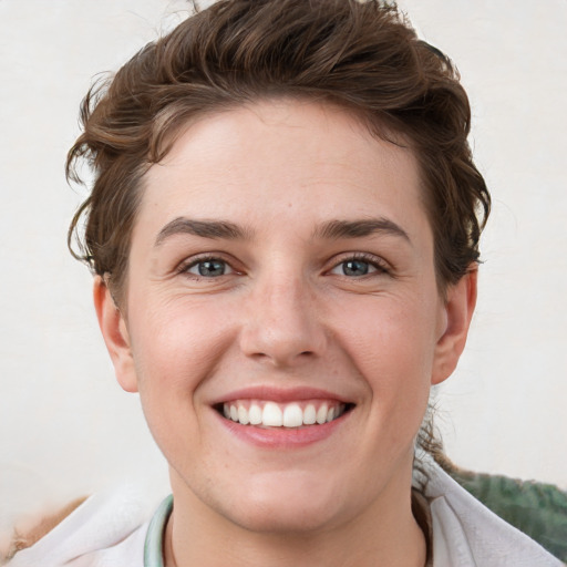 Joyful white young-adult female with short  brown hair and grey eyes