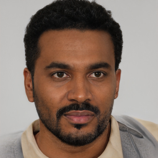 Neutral black young-adult male with short  black hair and brown eyes