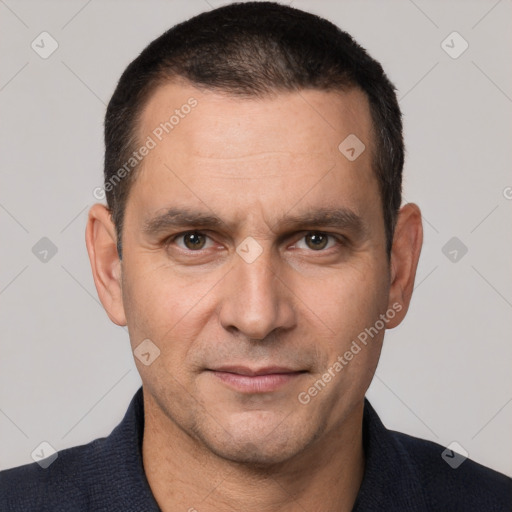 Joyful white adult male with short  brown hair and brown eyes