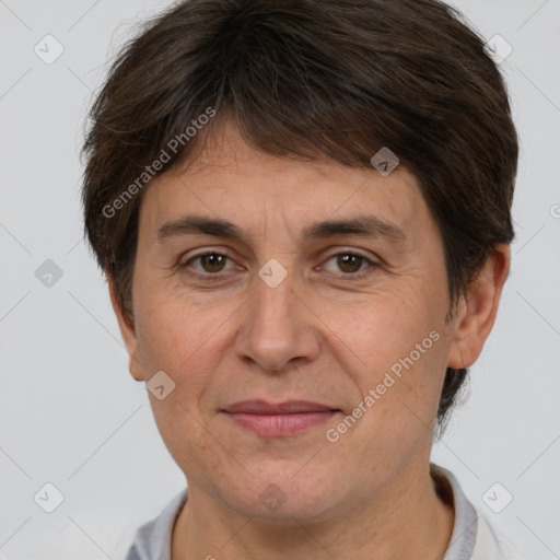 Joyful white adult female with short  brown hair and brown eyes