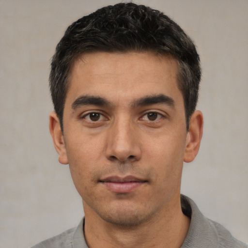 Neutral white young-adult male with short  black hair and brown eyes