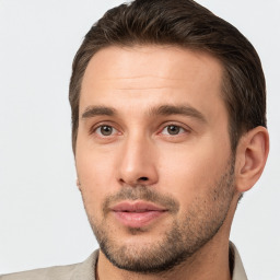 Joyful white young-adult male with short  brown hair and brown eyes