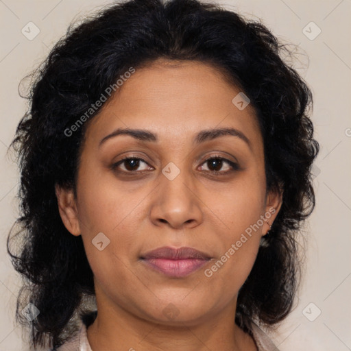 Joyful latino adult female with medium  brown hair and brown eyes