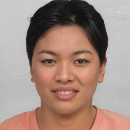 Joyful asian young-adult female with short  brown hair and brown eyes