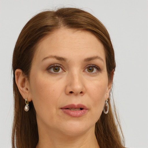 Joyful white young-adult female with long  brown hair and green eyes