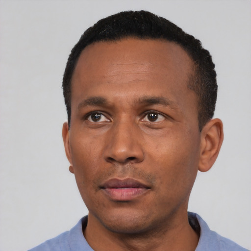Neutral black adult male with short  black hair and brown eyes