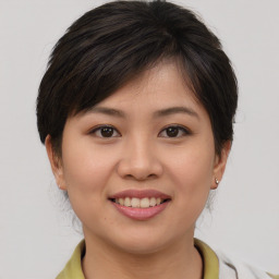 Joyful white young-adult female with medium  brown hair and brown eyes