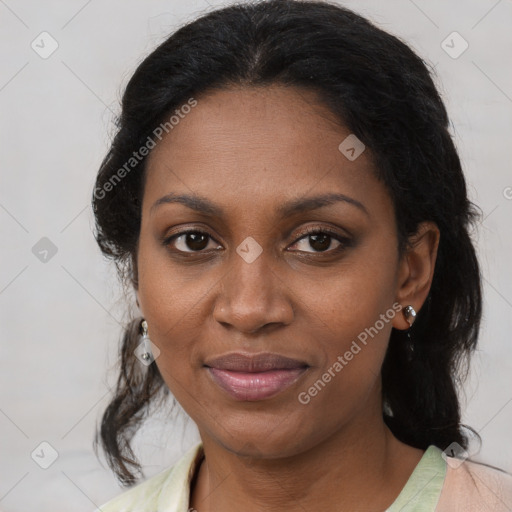 Joyful black adult female with medium  brown hair and brown eyes