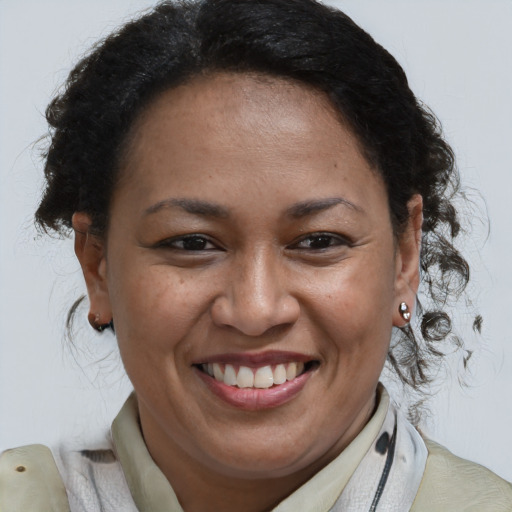 Joyful black adult female with short  brown hair and brown eyes