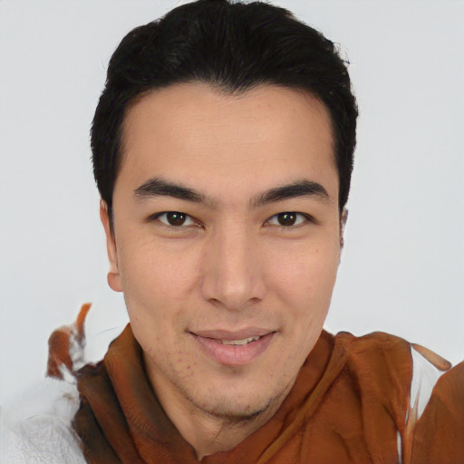 Joyful latino young-adult male with short  brown hair and brown eyes