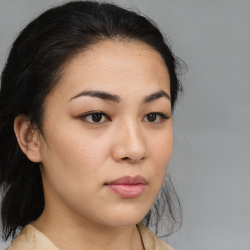 Neutral asian young-adult female with medium  brown hair and brown eyes