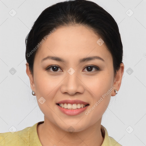 Joyful asian young-adult female with medium  brown hair and brown eyes