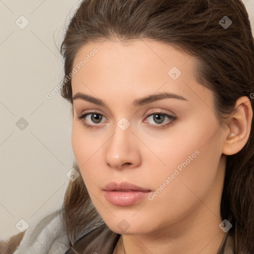 Neutral white young-adult female with long  brown hair and brown eyes