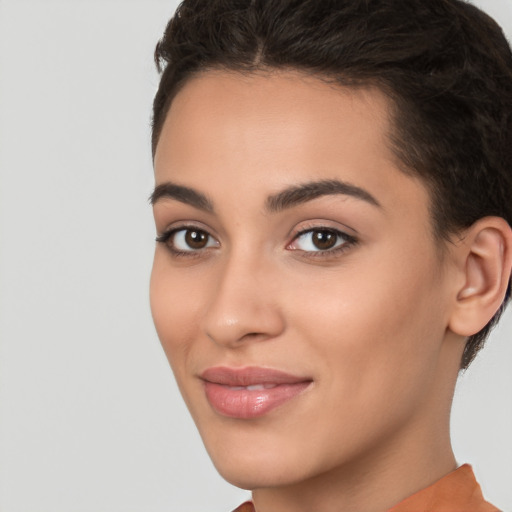 Joyful white young-adult female with short  brown hair and brown eyes