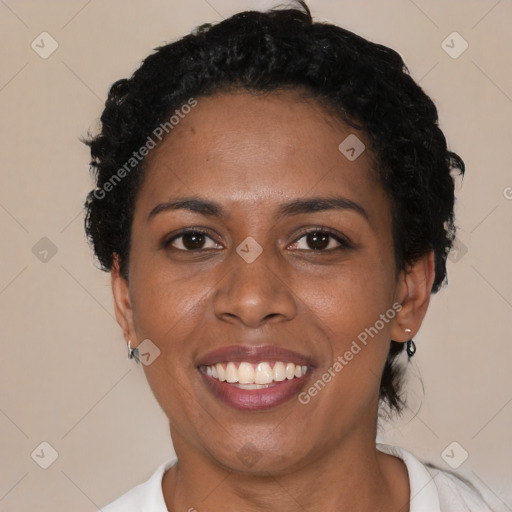 Joyful latino young-adult female with short  black hair and brown eyes