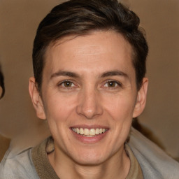 Joyful white adult male with short  brown hair and brown eyes