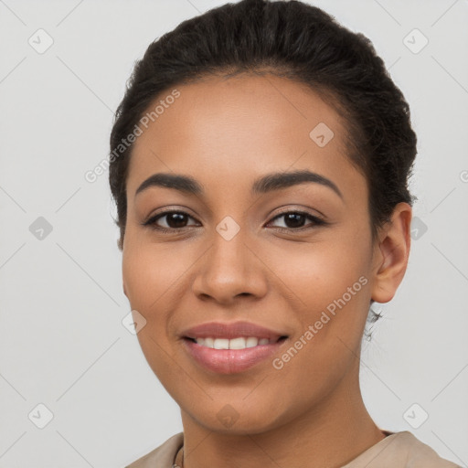 Joyful latino young-adult female with short  brown hair and brown eyes