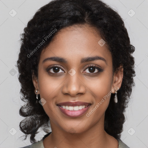 Joyful black young-adult female with long  black hair and brown eyes