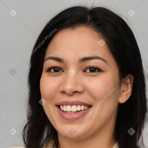 Joyful latino young-adult female with medium  brown hair and brown eyes