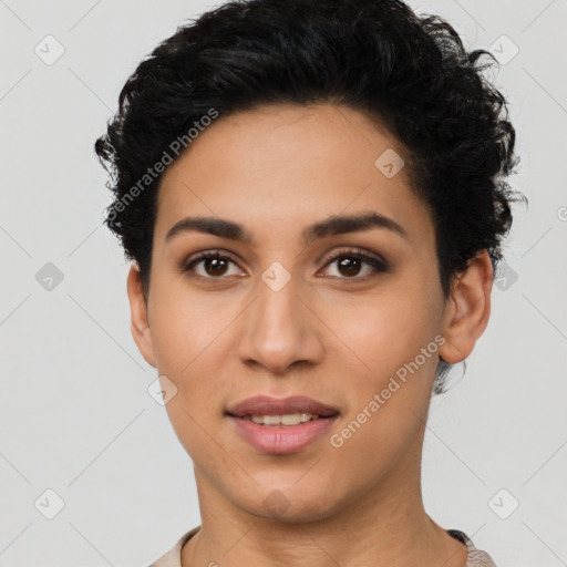 Joyful latino young-adult female with short  black hair and brown eyes