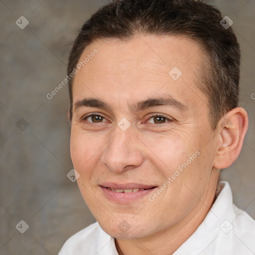 Joyful white adult male with short  brown hair and brown eyes