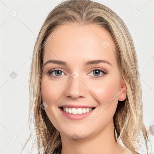 Joyful white young-adult female with long  brown hair and blue eyes