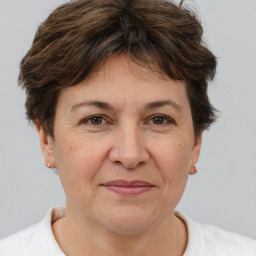 Joyful white adult female with short  brown hair and brown eyes