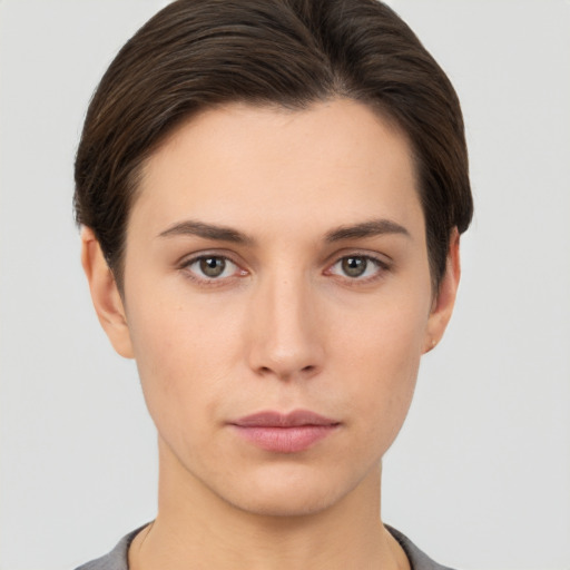 Neutral white young-adult female with short  brown hair and brown eyes