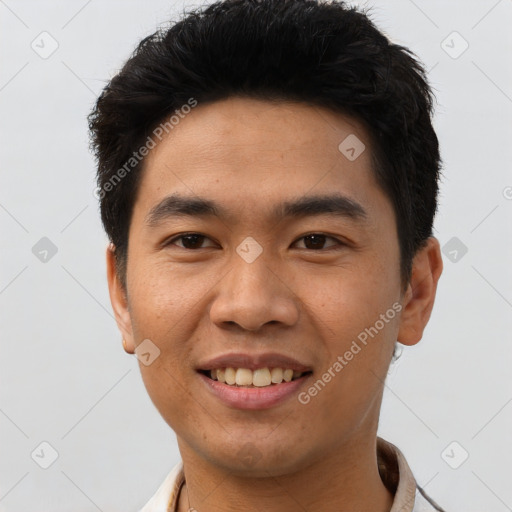 Joyful asian young-adult male with short  brown hair and brown eyes