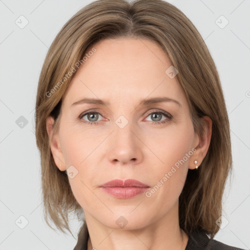 Joyful white adult female with medium  brown hair and grey eyes