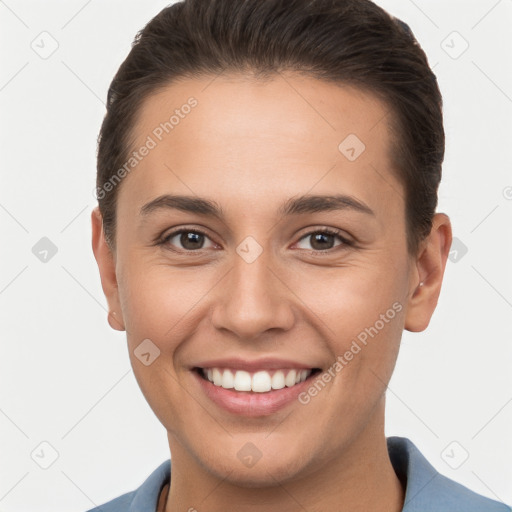 Joyful white young-adult female with short  brown hair and brown eyes