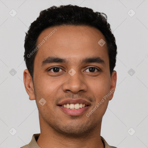 Joyful latino young-adult male with short  black hair and brown eyes