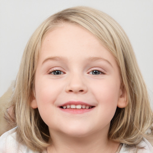 Joyful white child female with medium  brown hair and blue eyes