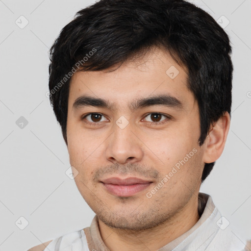 Joyful asian young-adult male with short  black hair and brown eyes