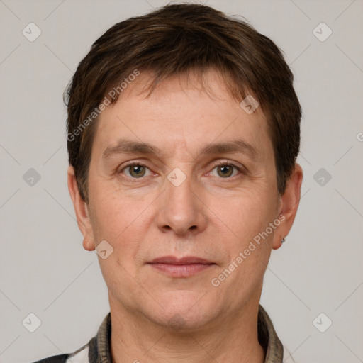 Joyful white adult male with short  brown hair and grey eyes