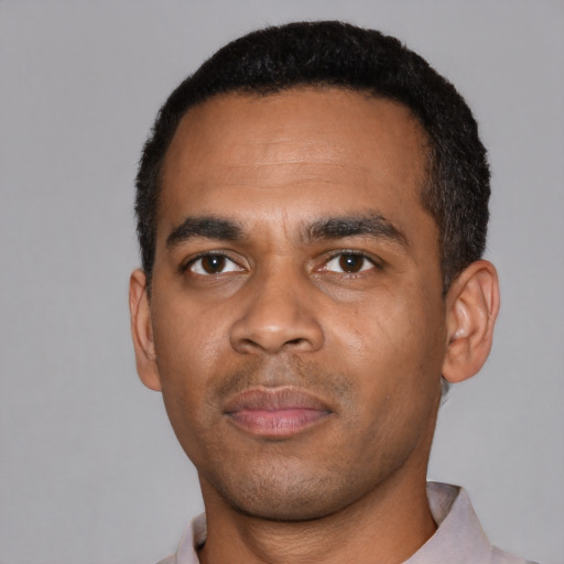Neutral black young-adult male with short  black hair and brown eyes