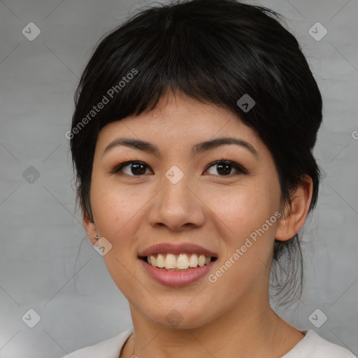 Joyful asian young-adult female with medium  black hair and brown eyes