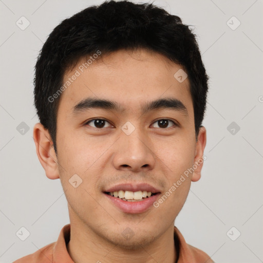 Joyful latino young-adult male with short  brown hair and brown eyes