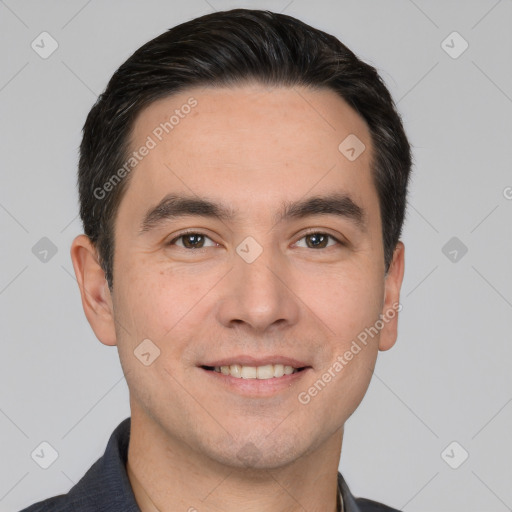 Joyful white young-adult male with short  black hair and brown eyes