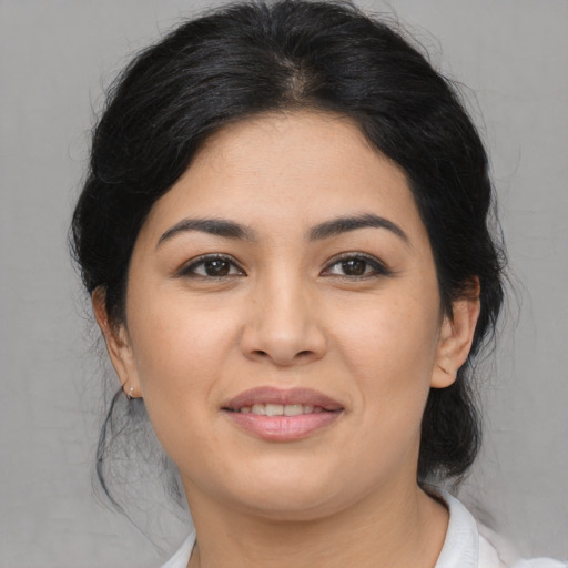 Joyful asian young-adult female with medium  black hair and brown eyes