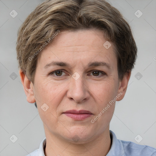 Joyful white adult female with short  brown hair and grey eyes