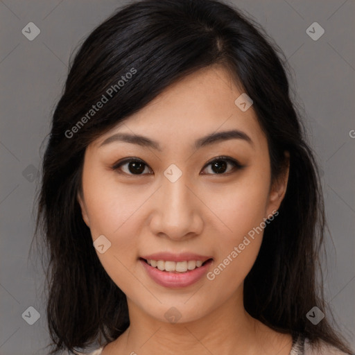 Joyful asian young-adult female with long  brown hair and brown eyes